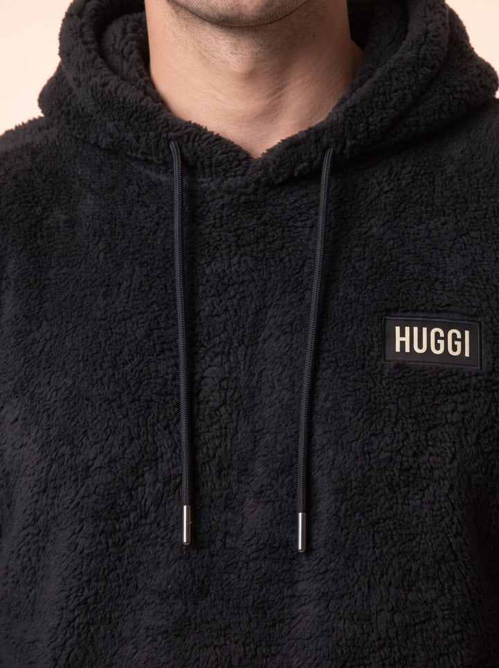Close-up of the black drawstrings and silver aglets on the Black sherpa fleece hoodie