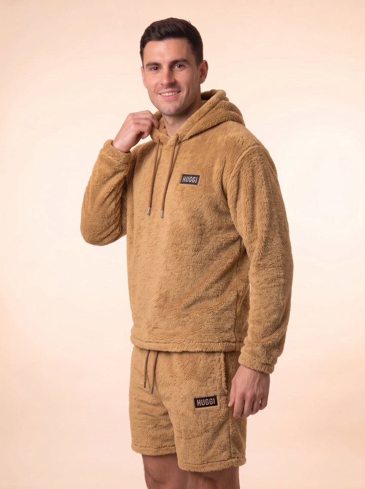 Side profile of the Brown Huggi Fleece Two-Piece Set model: Luke is 6&