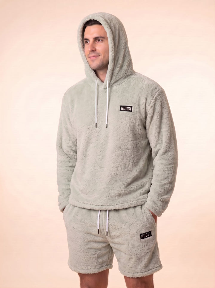 Huggi Fleece Two-Piece Set in Light Green – studio shot with the hood up model: Luke is 6&