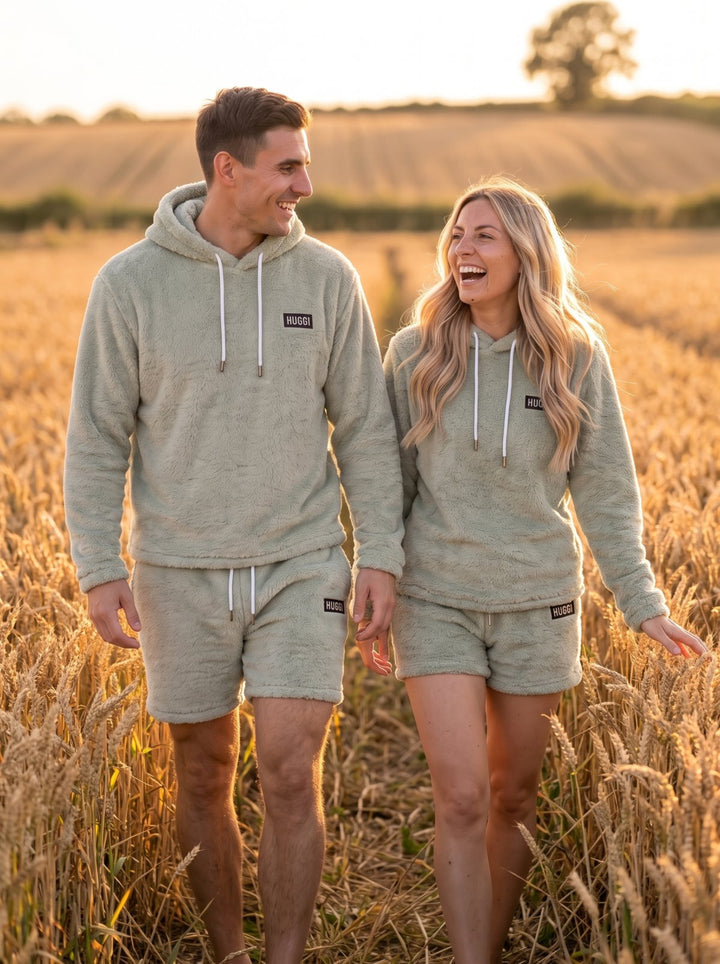 Couple wearing the Huggi Fleece Two-Piece Set in Light Green in a wheat field model: Emma is 5&