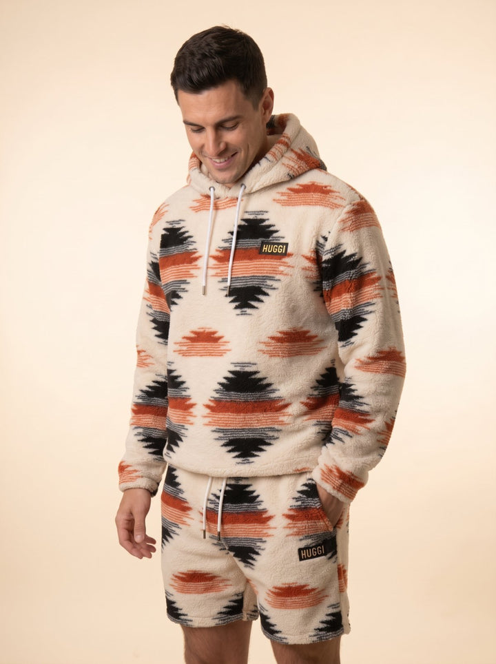 Huggi Fleece Two-Piece Set in White &amp; Orange Aztec print – three-quarter view of hoodie and shorts model: Luke is 6&